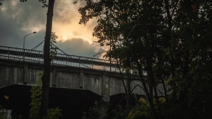 Cloudy Sunset Over Bridge